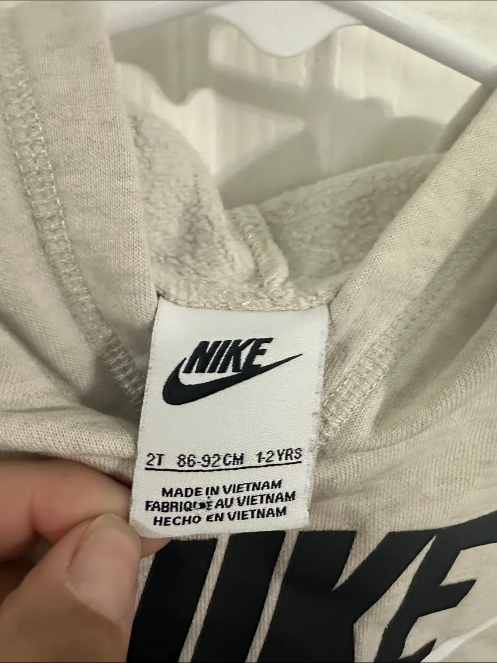 Nike Kids Beige Hoodie with Black Logo and White Swoosh